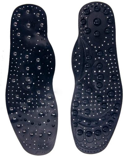 two black insoles with visible acupressure bumps